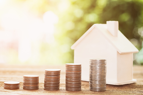 House with stacks of coins